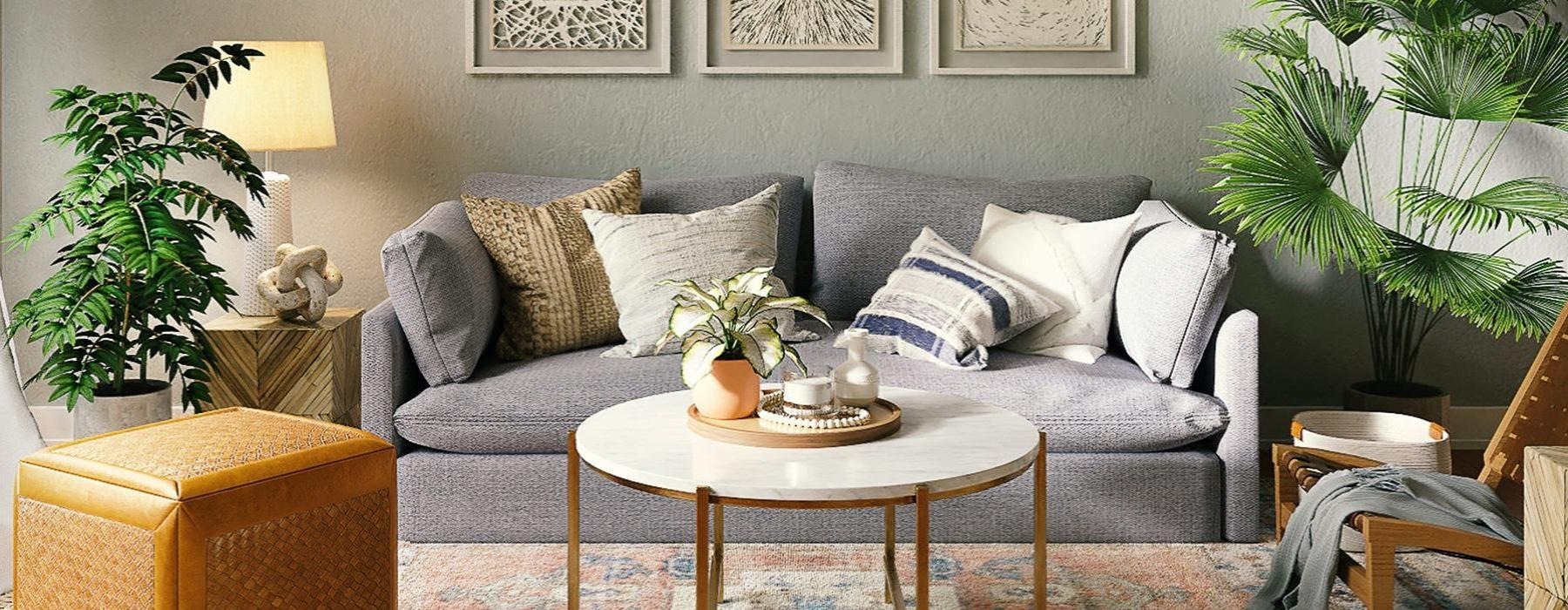 a couch with a coffee table and plants