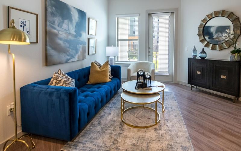 a living room with a blue couch